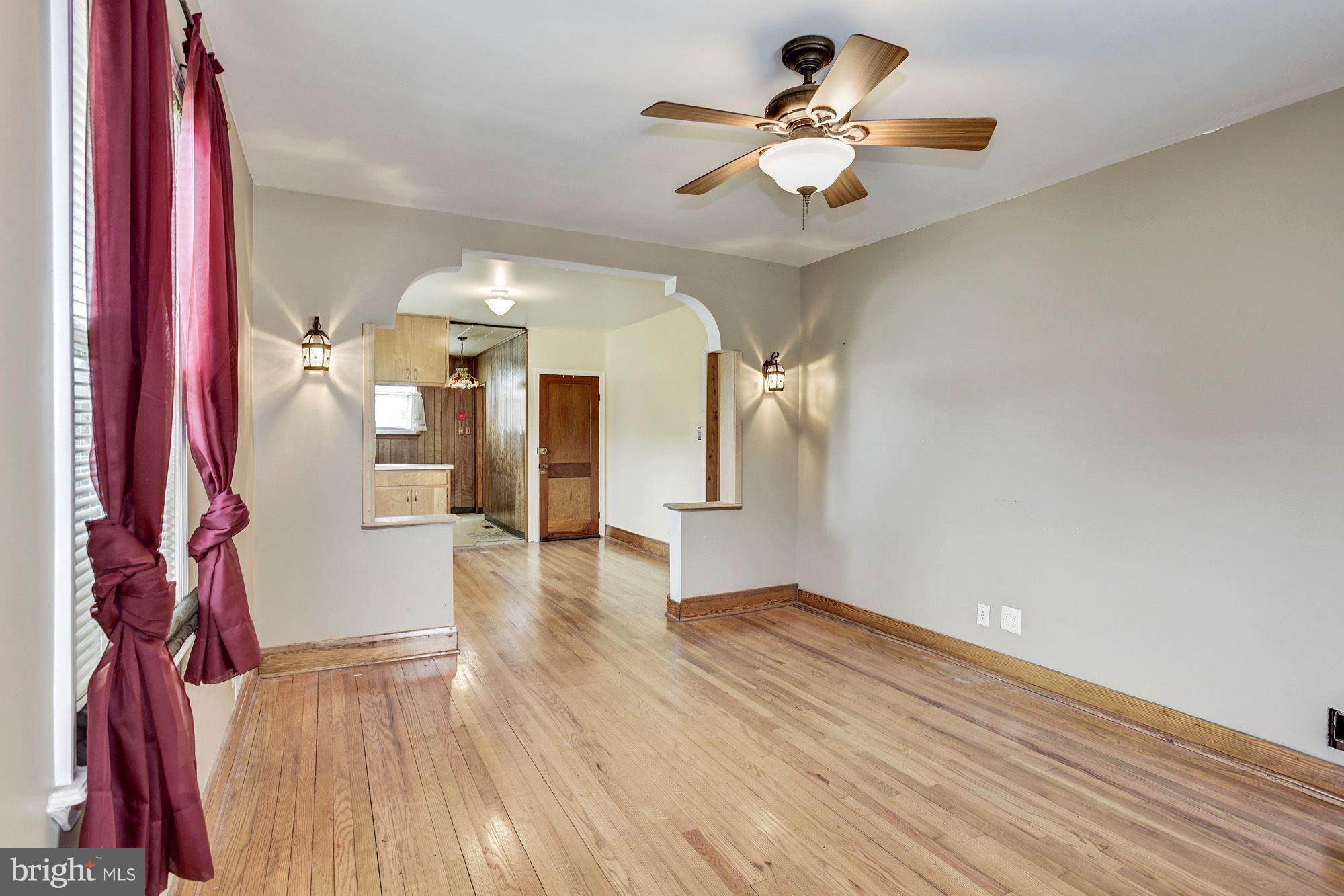 4613 Annapolis Road Baltimore, MD 21227 - Photo 3 of 15 a view of empty room with wooden floor