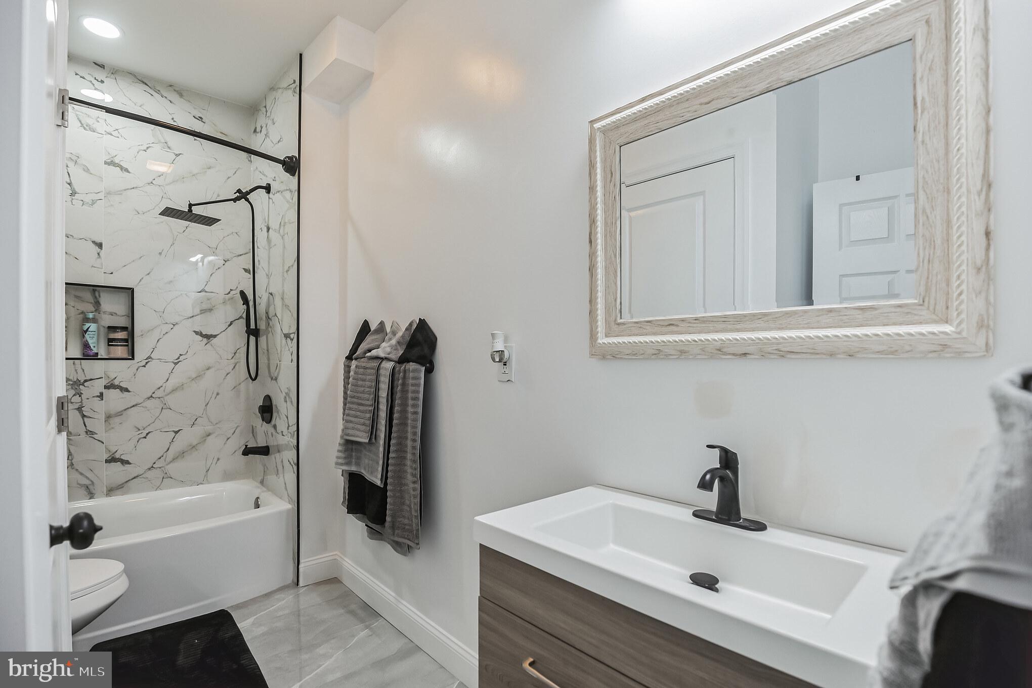 207 MacDade Boulevard Collingdale, PA 19023 - Photo 7 of 30 Brand new bathroom with custom tile.
