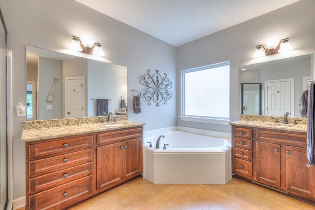 a view of an entryway wooden floor and dining room