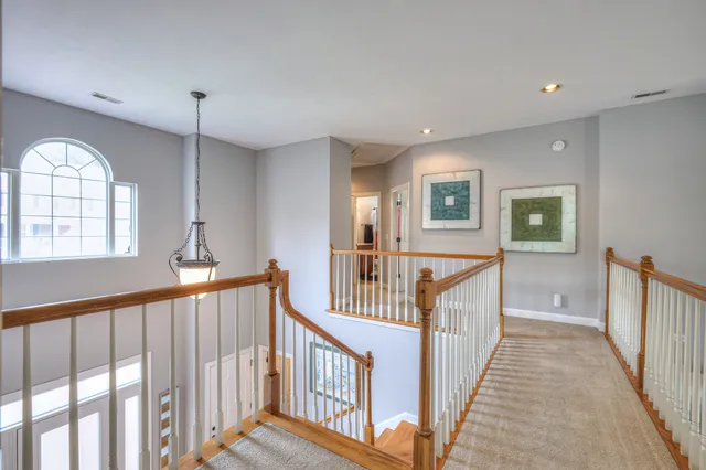 a bathroom with a granite countertop sink mirror vanity and toilet