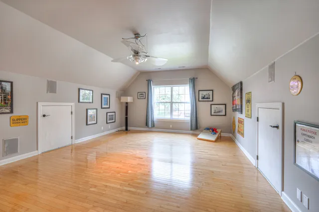 a view of a deck with furniture and wooden floor