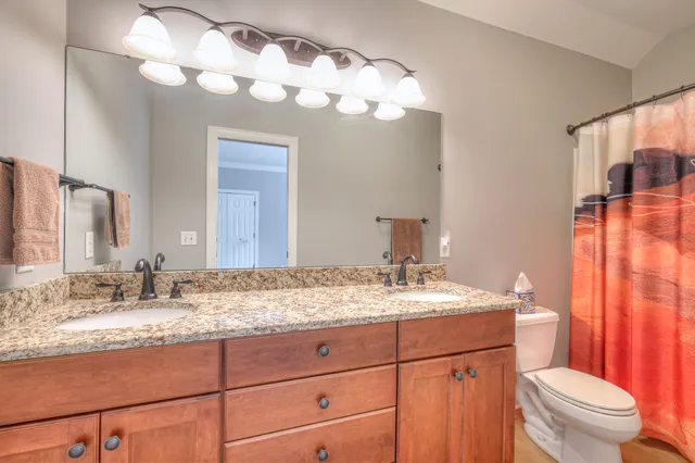 a view of a house with a yard and sitting area