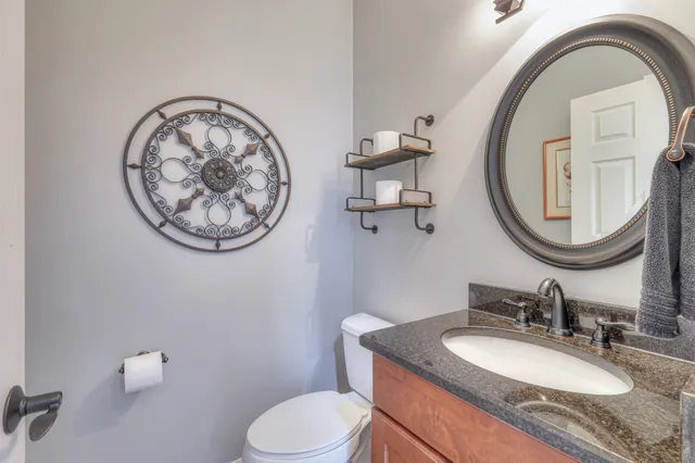 a bedroom with furniture and a fireplace