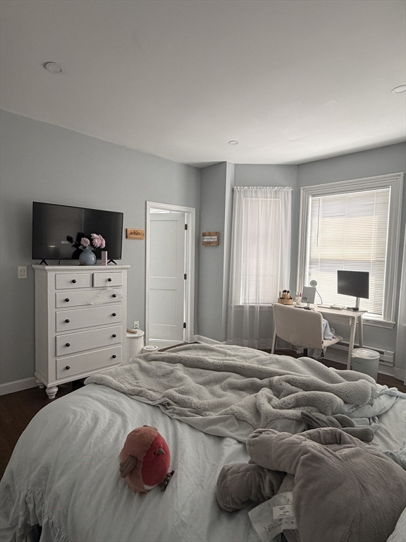 562 East 7th Street, Unit 2 Boston, MA 02127 - Photo 12 of 18 a bedroom with a bed and dresser