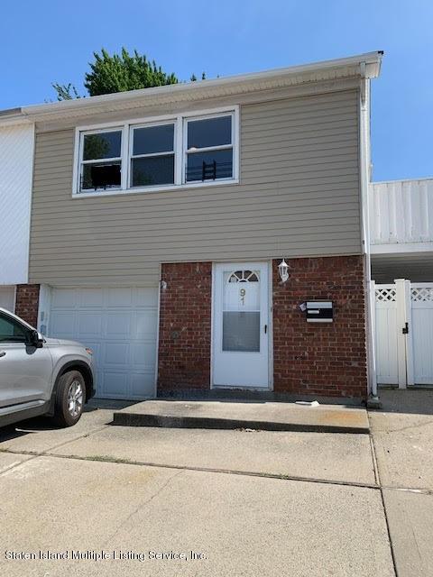91 Middle Loop Road Staten Island, NY 10308 - Photo 1 of 13 a front view of a house