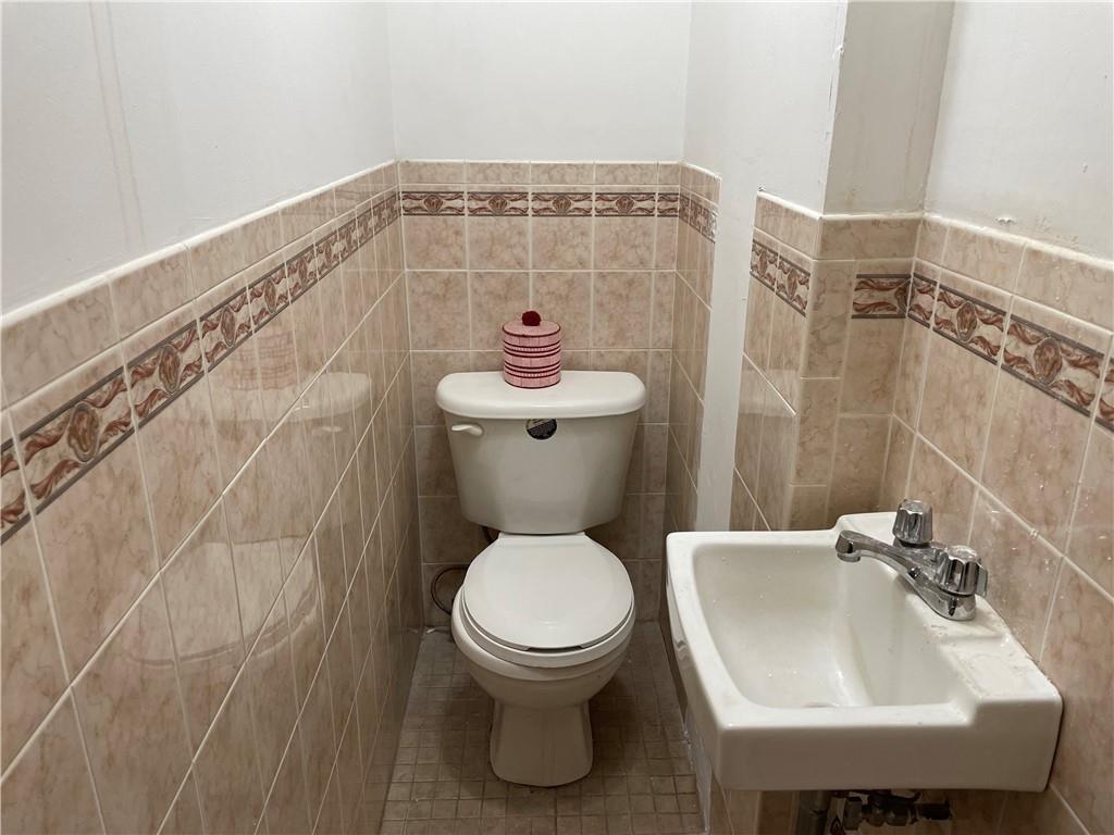 46 A Windsor Place Brooklyn, NY 11215 - Photo 14 of 24 a bathroom with a sink and a toilet