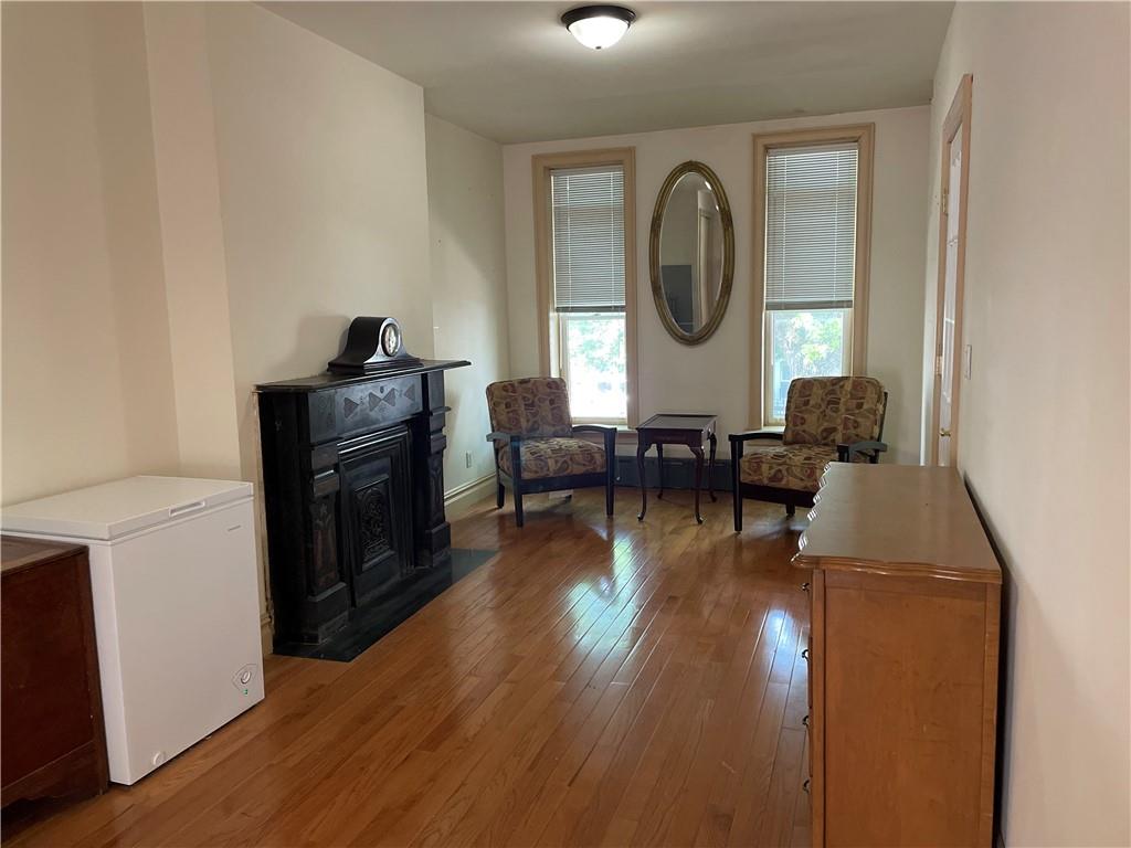 46 A Windsor Place Brooklyn, NY 11215 - Photo 17 of 24 a living room with furniture and a wooden floor