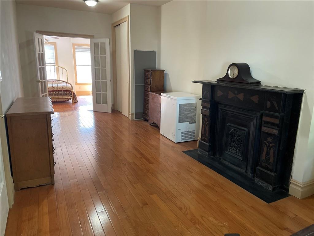 46 A Windsor Place Brooklyn, NY 11215 - Photo 18 of 24 a living room with furniture and a fireplace
