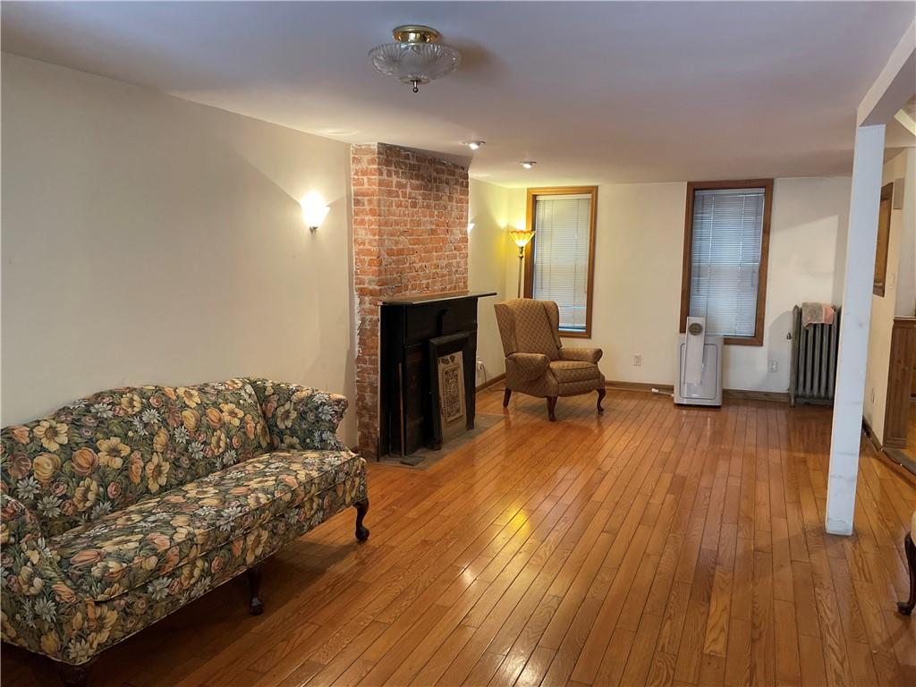 46 A Windsor Place Brooklyn, NY 11215 - Photo 20 of 24 a living room with furniture and a fireplace