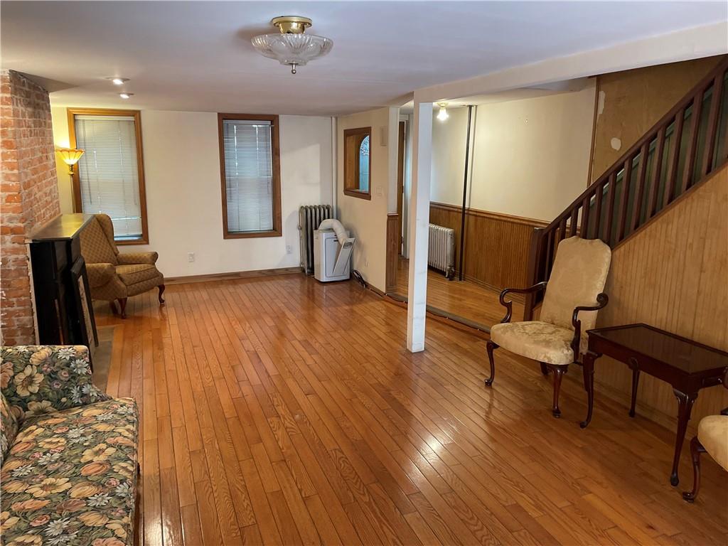 46 A Windsor Place Brooklyn, NY 11215 - Photo 22 of 24 a living room with furniture and a wooden floor