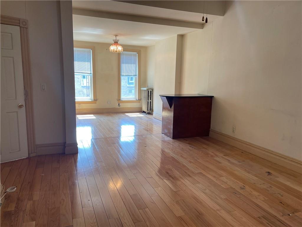 46 A Windsor Place Brooklyn, NY 11215 - Photo 5 of 24 a view of an empty room with wooden floor and windows