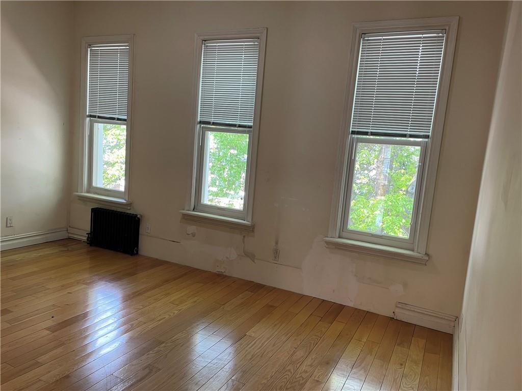 46 A Windsor Place Brooklyn, NY 11215 - Photo 7 of 24 an empty room with wooden floor and windows