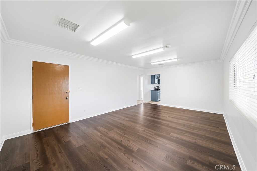 6331 Pedley Road Jurupa Valley, CA 92509 - Photo 33 of 45 an empty room with wooden floor and windows
