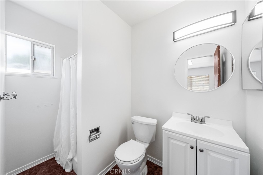 6331 Pedley Road Jurupa Valley, CA 92509 - Photo 42 of 45 a white toilet sitting next to a bathroom sink