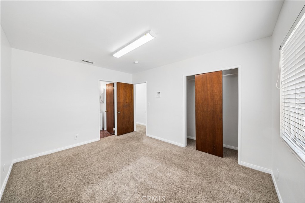 6331 Pedley Road Jurupa Valley, CA 92509 - Photo 43 of 45 an empty room with windows and closet