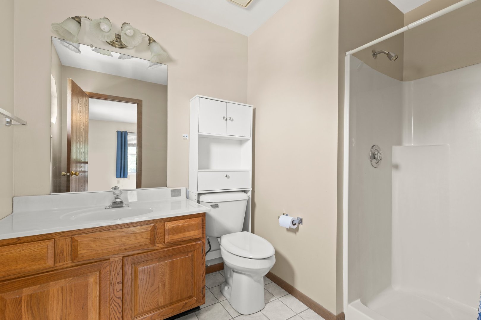 134 Meadows Drive Sugar Grove, IL 60554 - Photo 11 of 20 a bathroom with a toilet sink and mirror