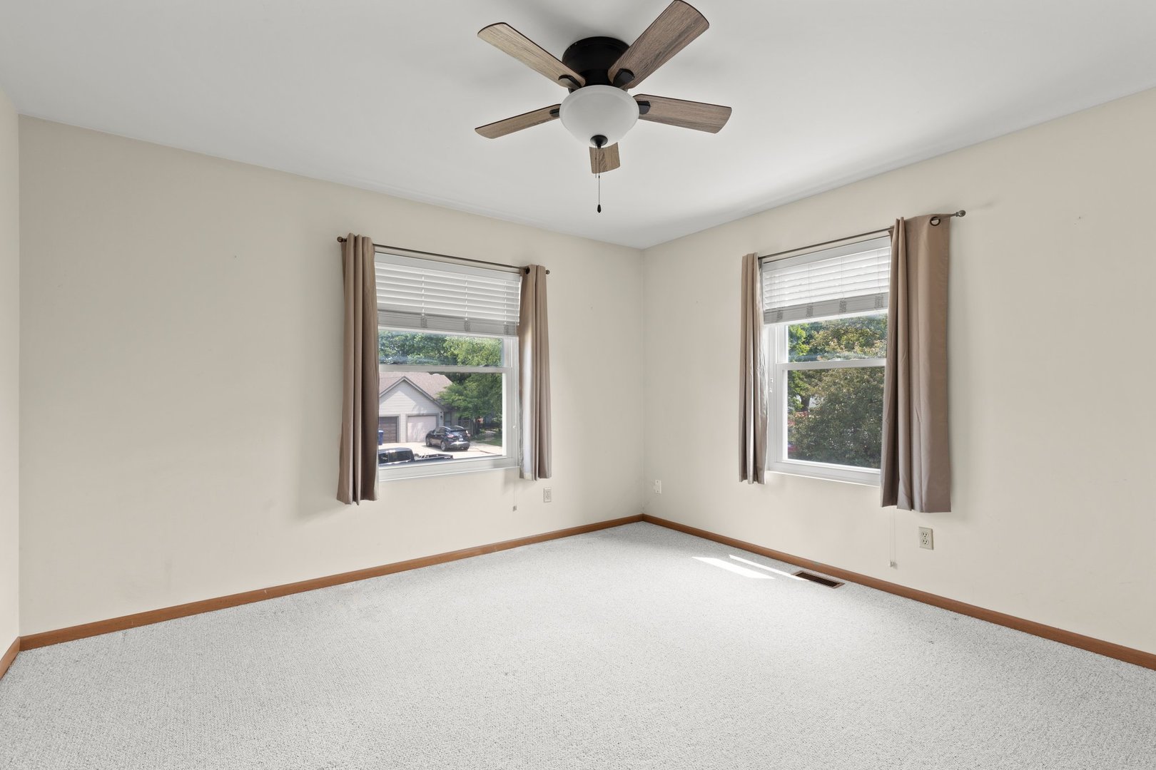134 Meadows Drive Sugar Grove, IL 60554 - Photo 13 of 20 an empty room with a window and a ceiling fan