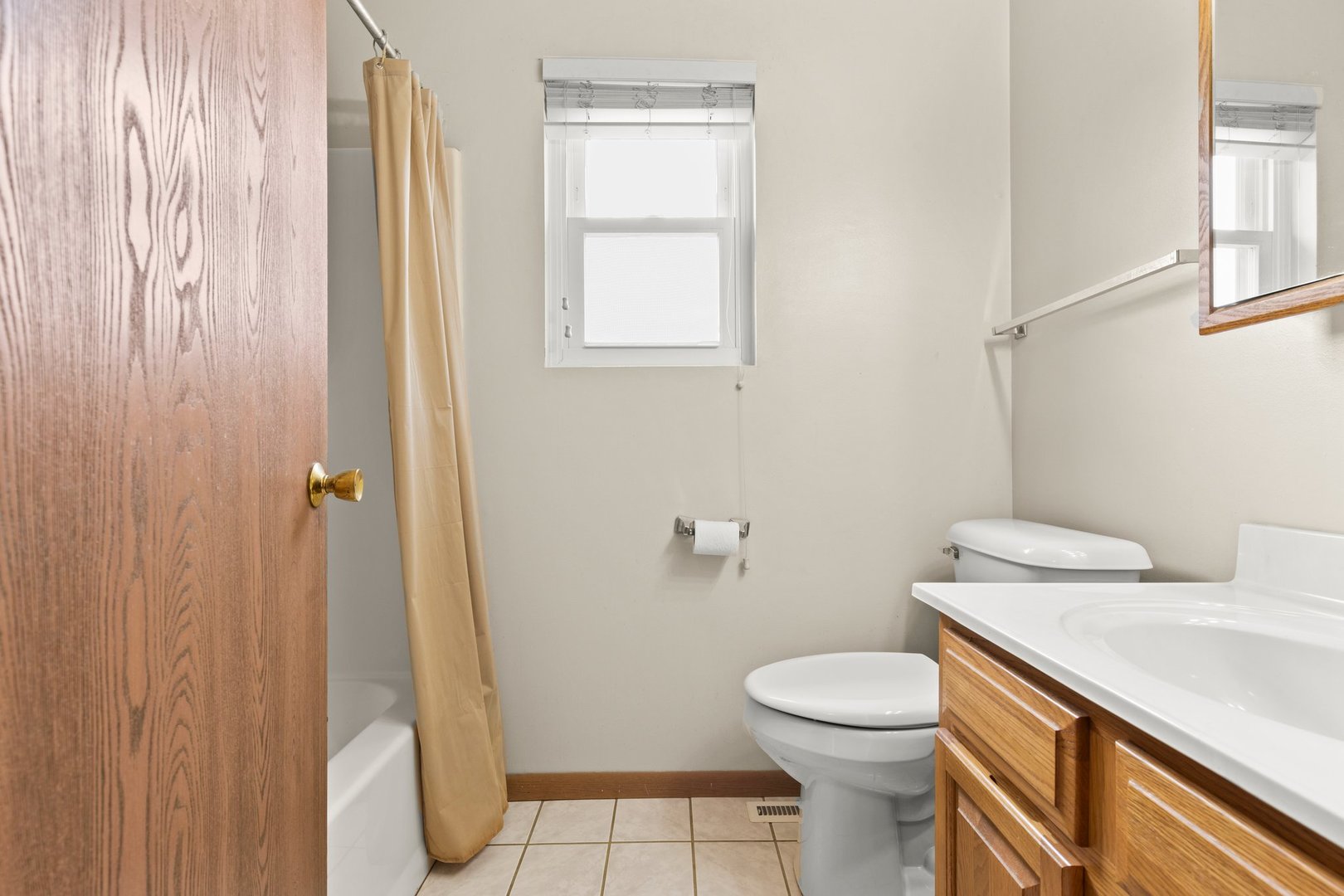 134 Meadows Drive Sugar Grove, IL 60554 - Photo 14 of 20 a white toilet sitting next to a bathroom sink and a shower