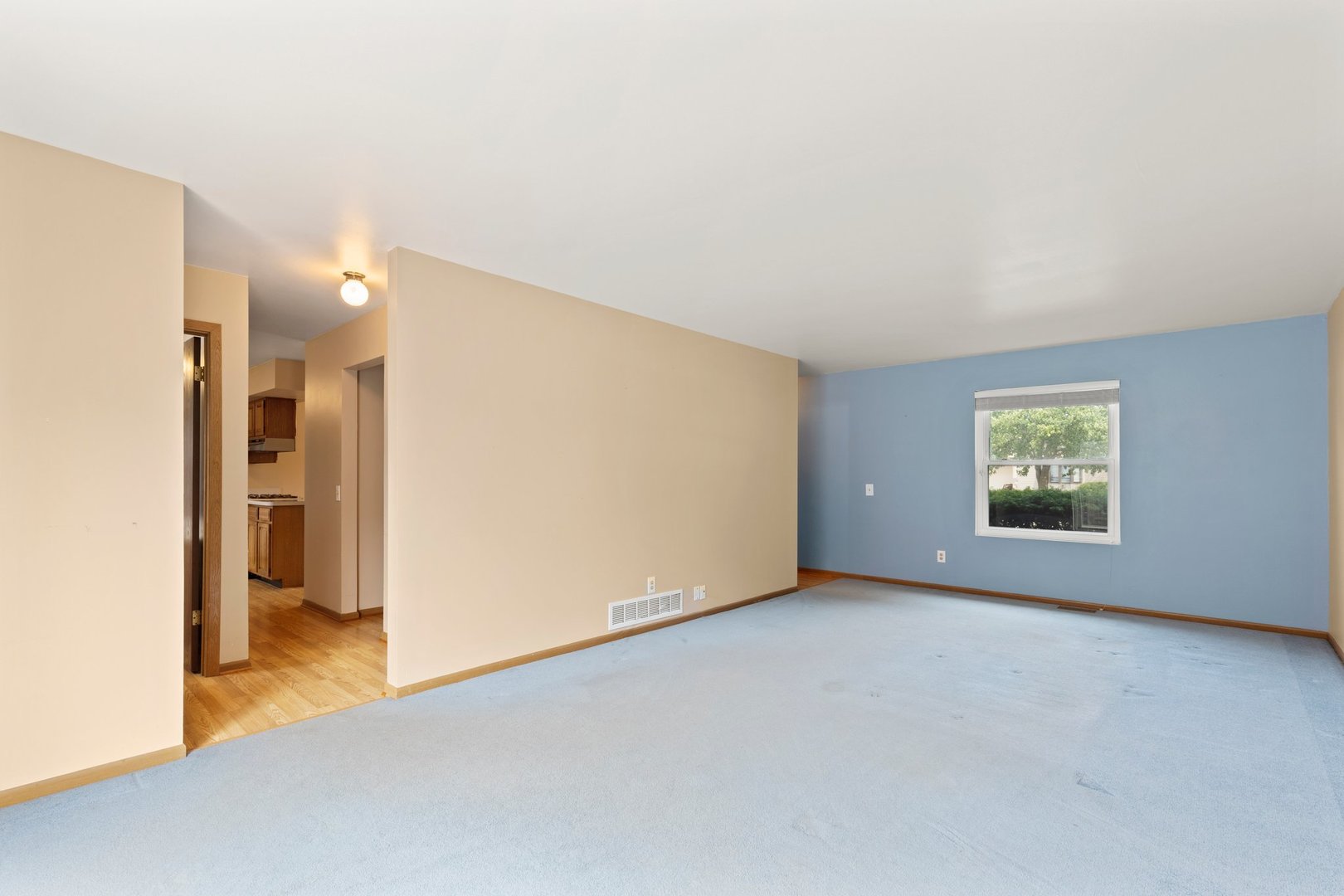 134 Meadows Drive Sugar Grove, IL 60554 - Photo 4 of 20 a view of an empty room with a window