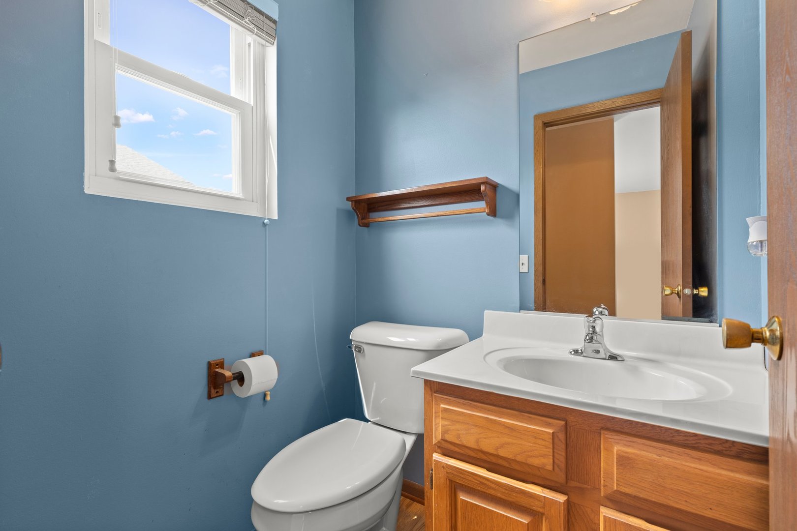 134 Meadows Drive Sugar Grove, IL 60554 - Photo 5 of 20 a bathroom with a sink a toilet and a mirror