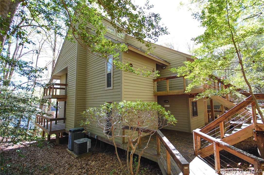 54 D Villa Ridge Drive, Unit D Hartfield, VA 23071 - Photo 22 of 34 SIDE VIEW OF WELL MAINTAINED CONDO