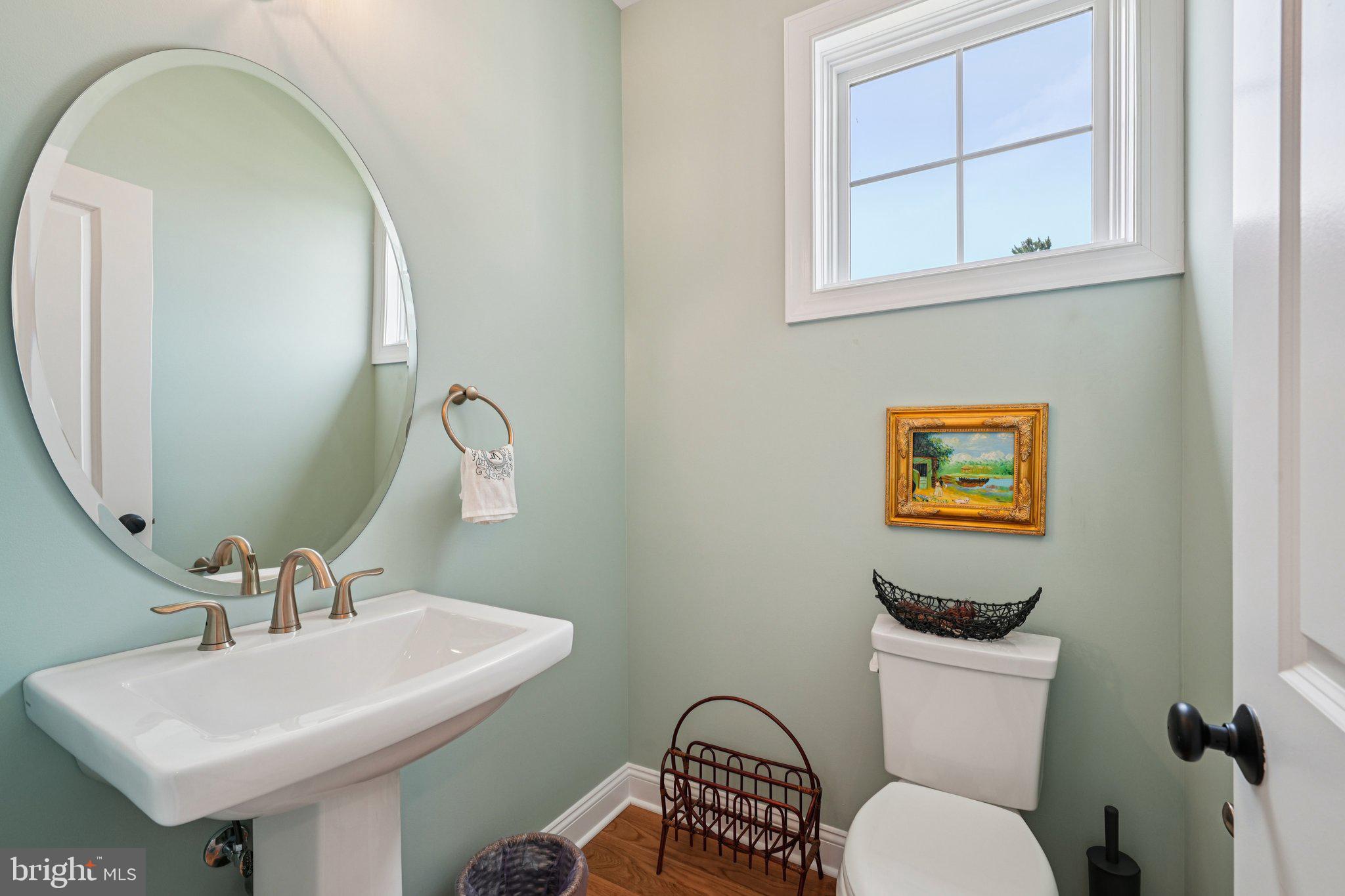 4459 Old Saucon Road Bethlehem, PA 18015 - Photo 14 of 40 a bathroom with a toilet a sink and a mirror