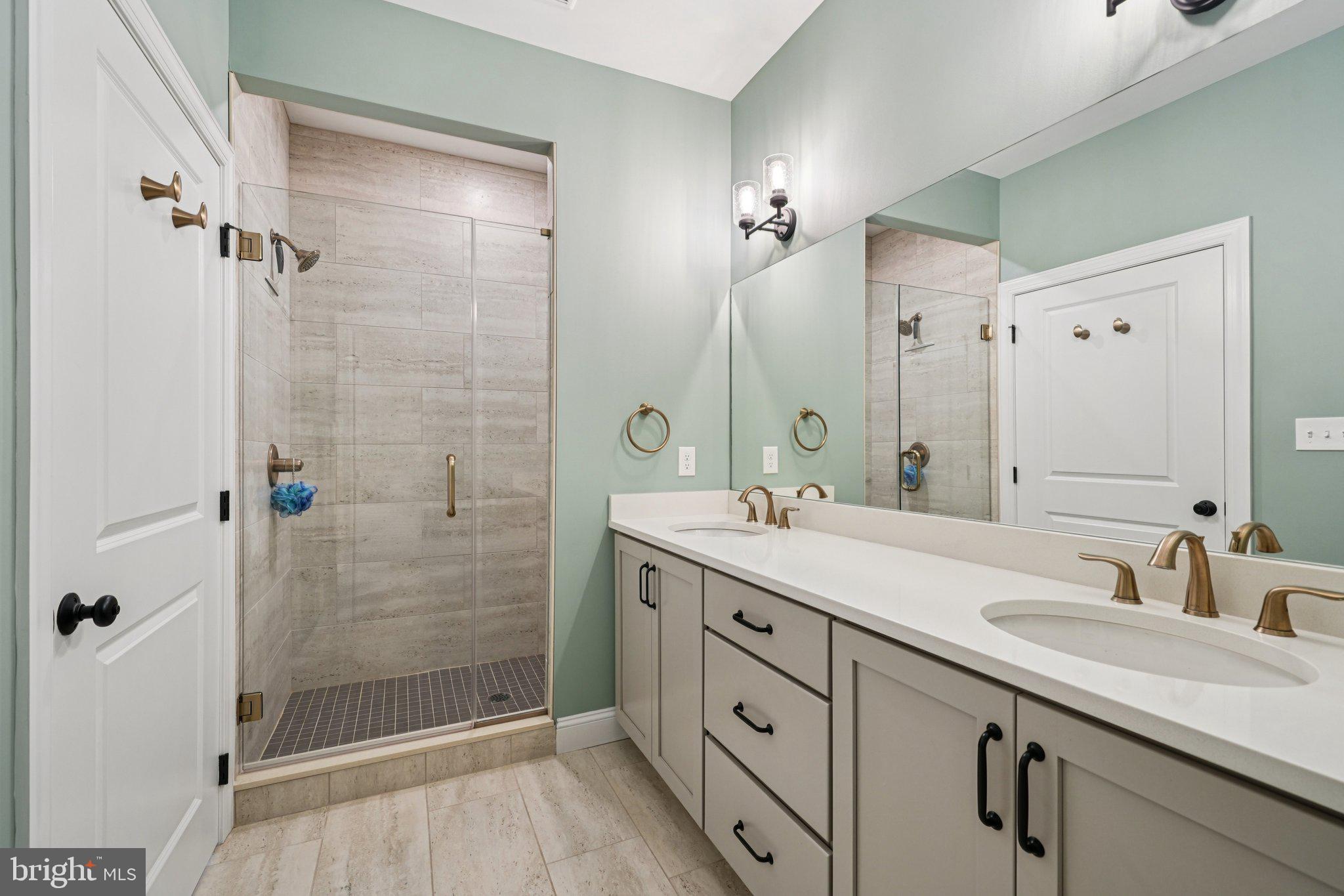 4459 Old Saucon Road Bethlehem, PA 18015 - Photo 18 of 40 a bathroom with a shower sink and mirror