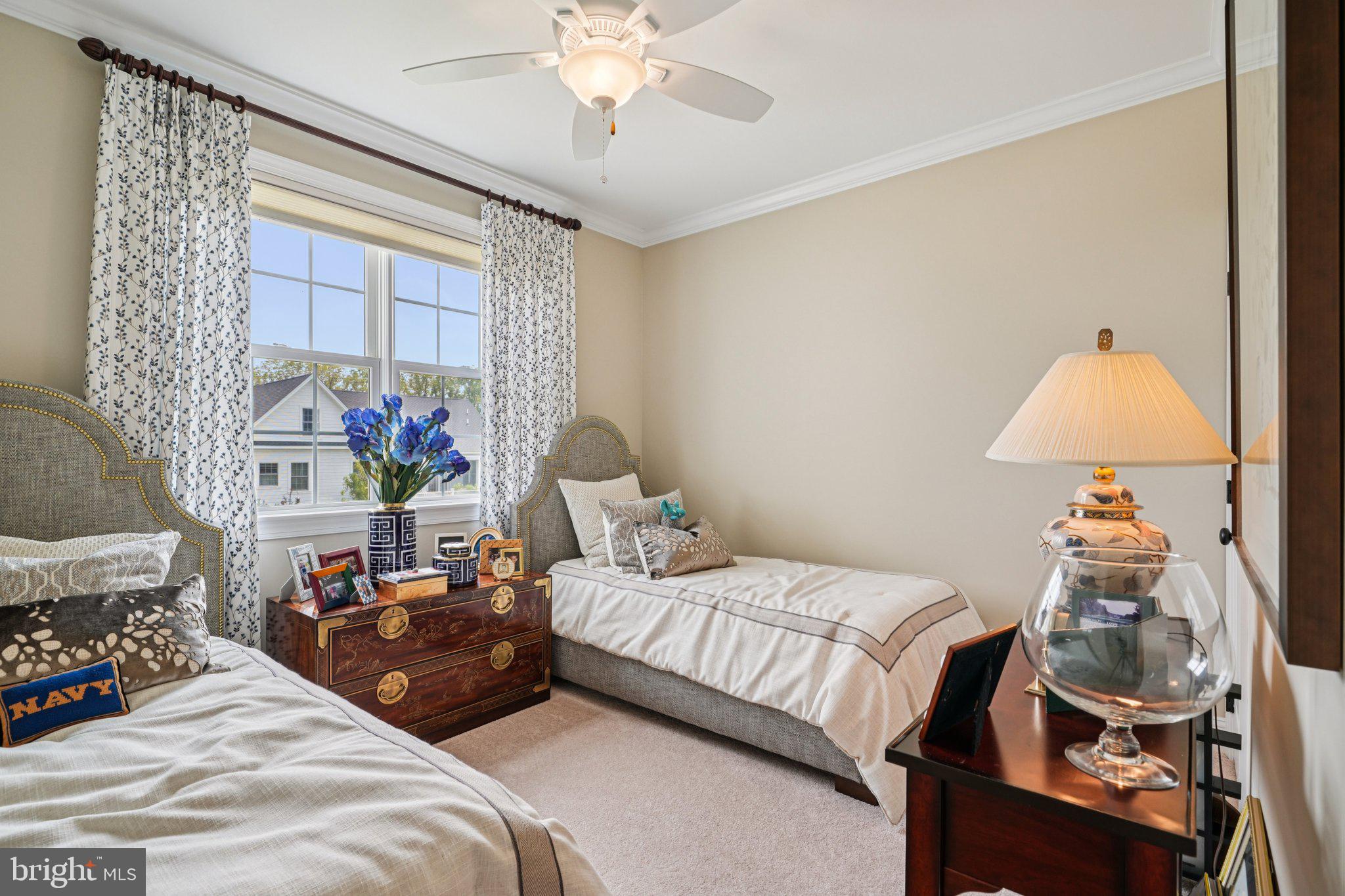 4459 Old Saucon Road Bethlehem, PA 18015 - Photo 20 of 40 a bedroom with a bed and a chandelier