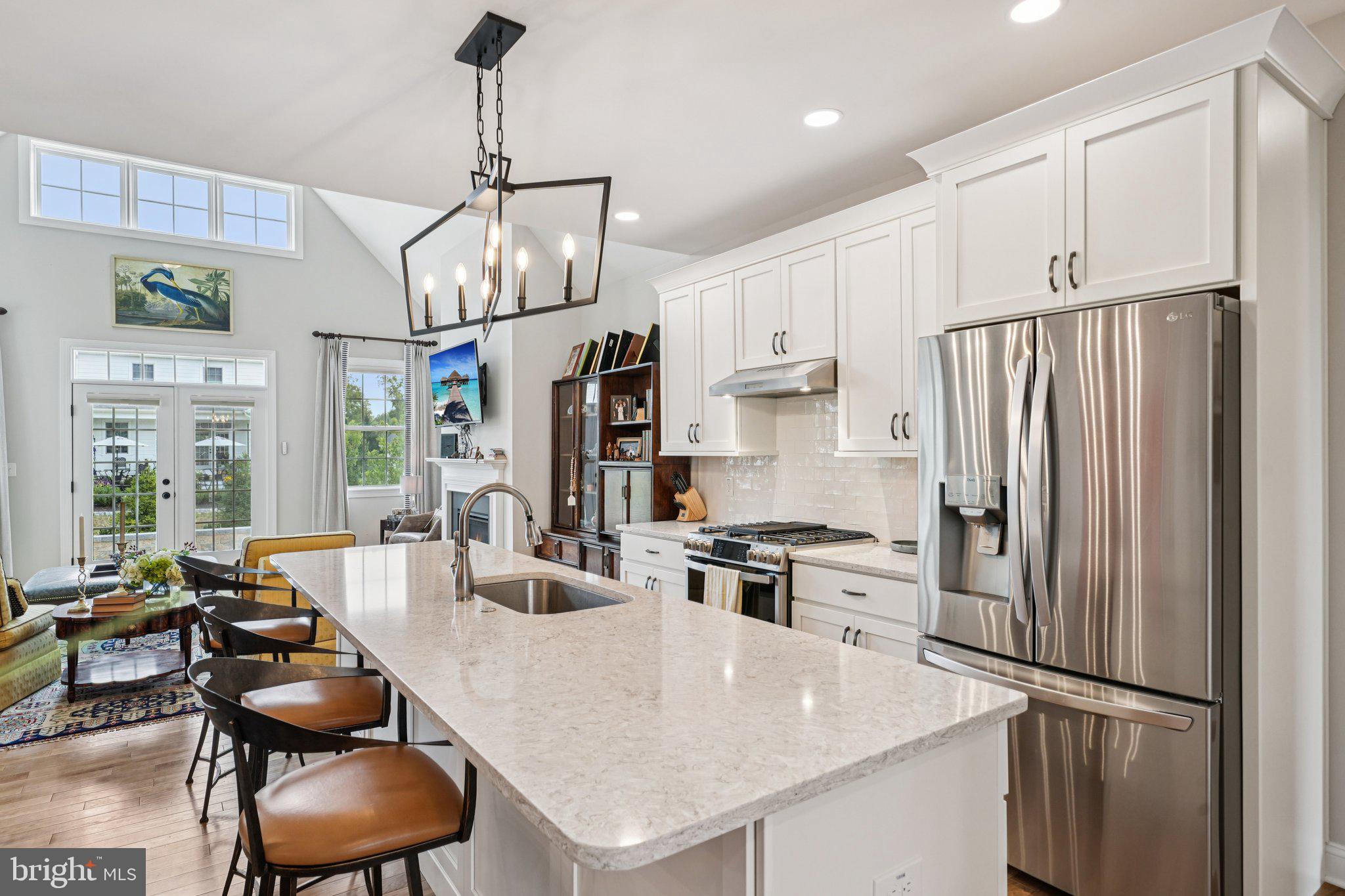 4459 Old Saucon Road Bethlehem, PA 18015 - Photo 7 of 40 a kitchen with stainless steel appliances a refrigerator a stove a sink a dining table and chairs