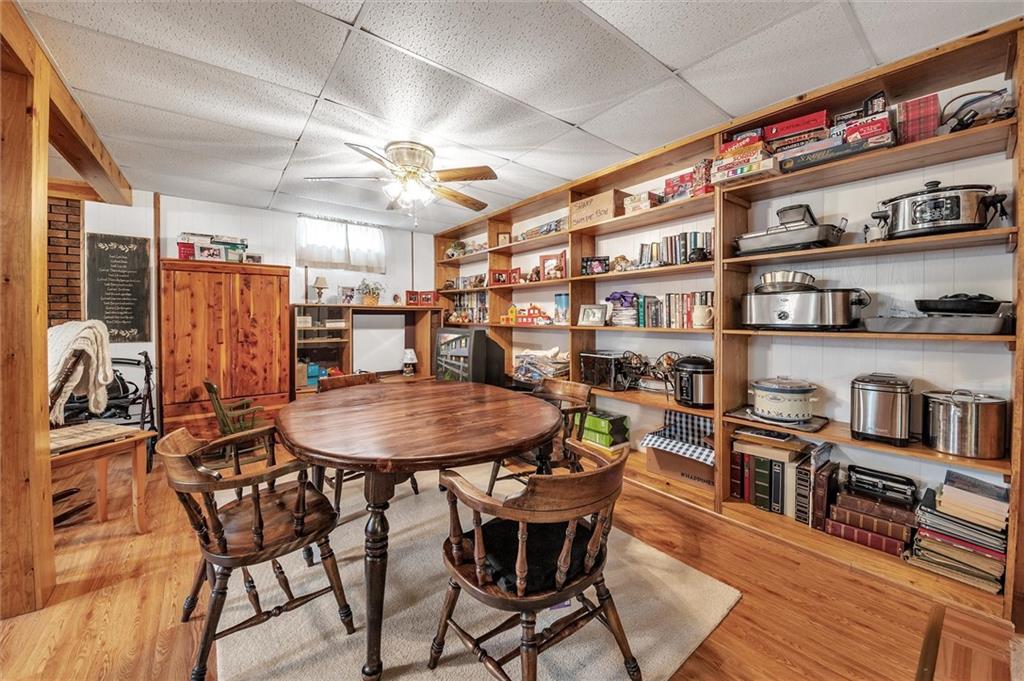 10 Rayne Church Road Indiana, PA 15701 - Photo 18 of 25 a dining room with stainless steel appliances kitchen island a table chairs and a bookshelf
