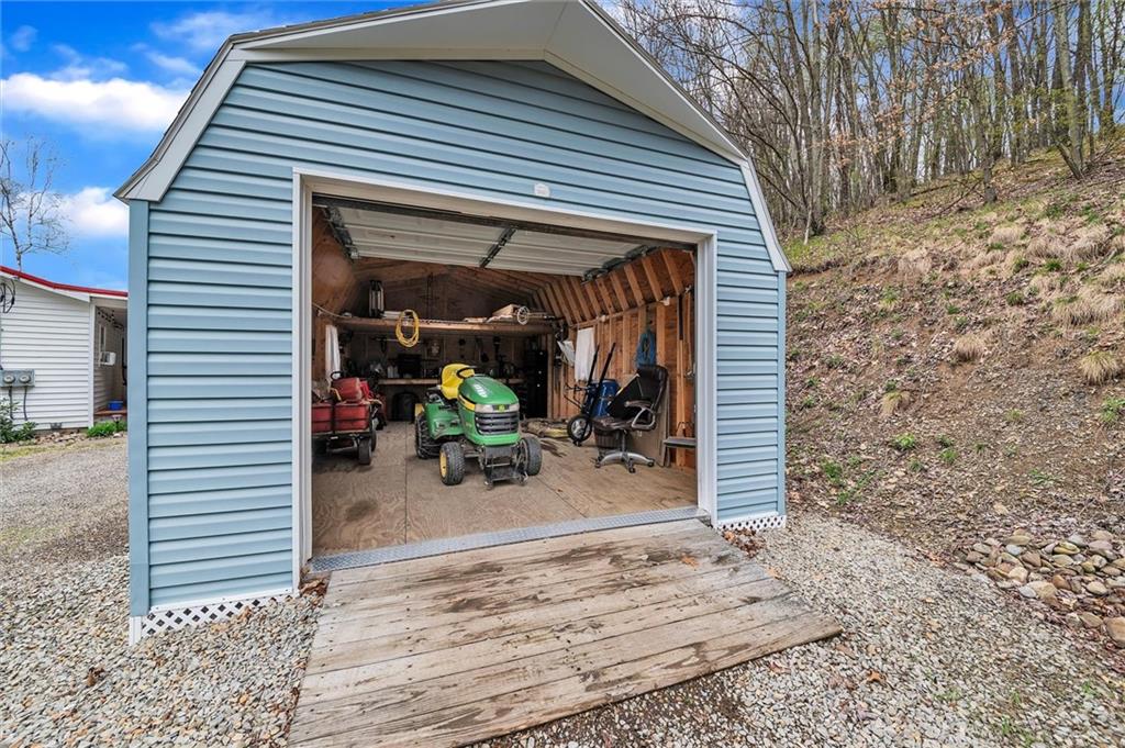 10 Rayne Church Road Indiana, PA 15701 - Photo 20 of 25 a view of a patio with table and chairs and wooden floor