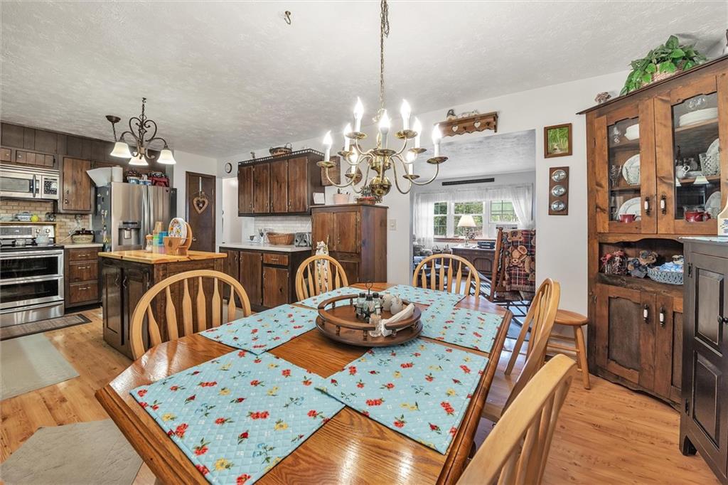 10 Rayne Church Road Indiana, PA 15701 - Photo 9 of 25 a kitchen dining table chairs and chandelier