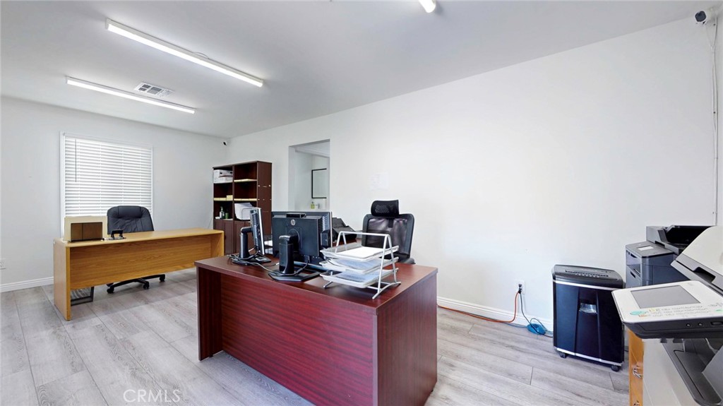 6851 Foothill Boulevard Tujunga, CA 91042 - Photo 12 of 50 a view of a workspace with furniture and wooden floor