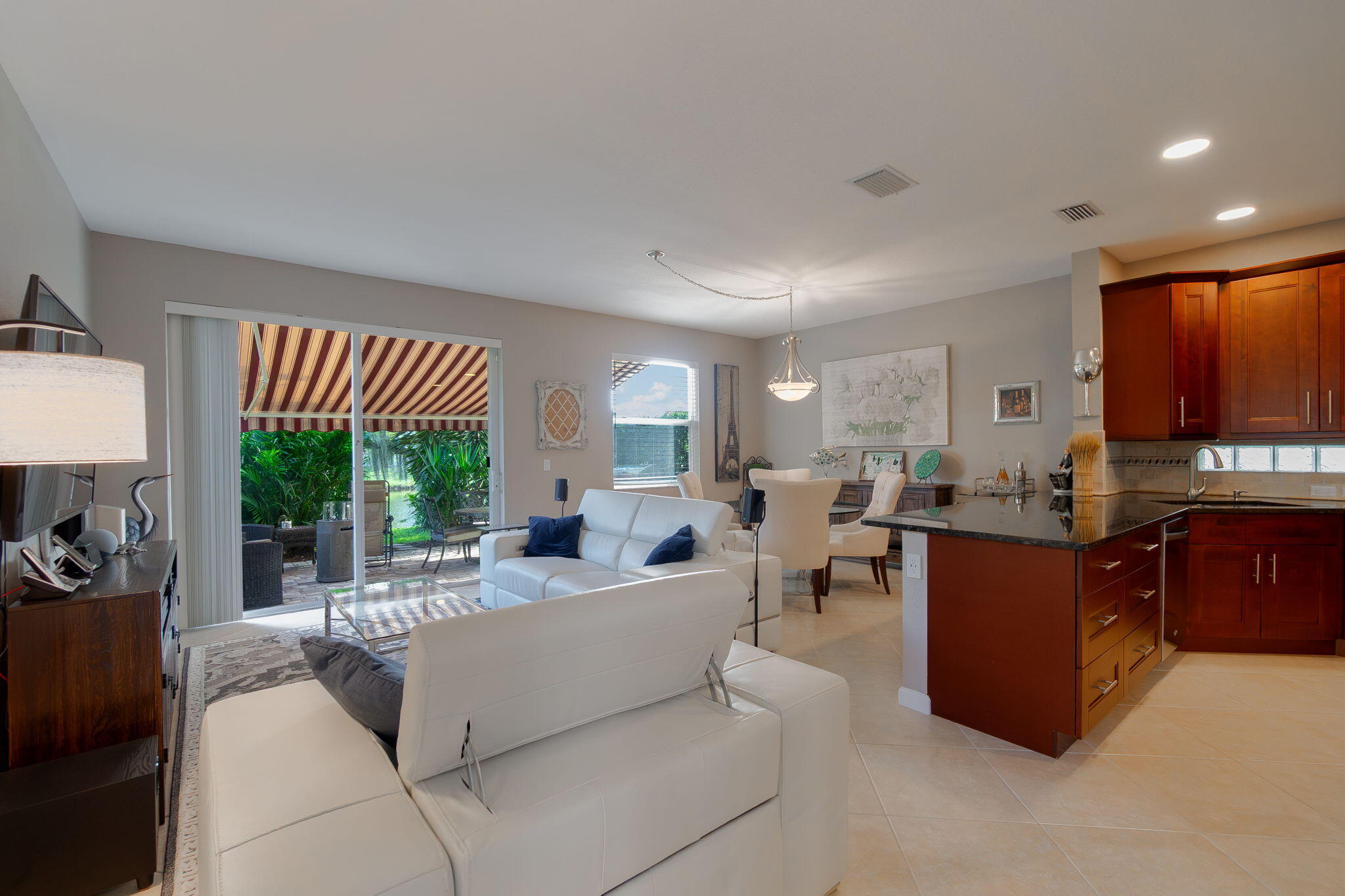 1004 Center Stone Lane Riviera Beach, FL 33404 - Photo 11 of 47 a living room with furniture and a large window
