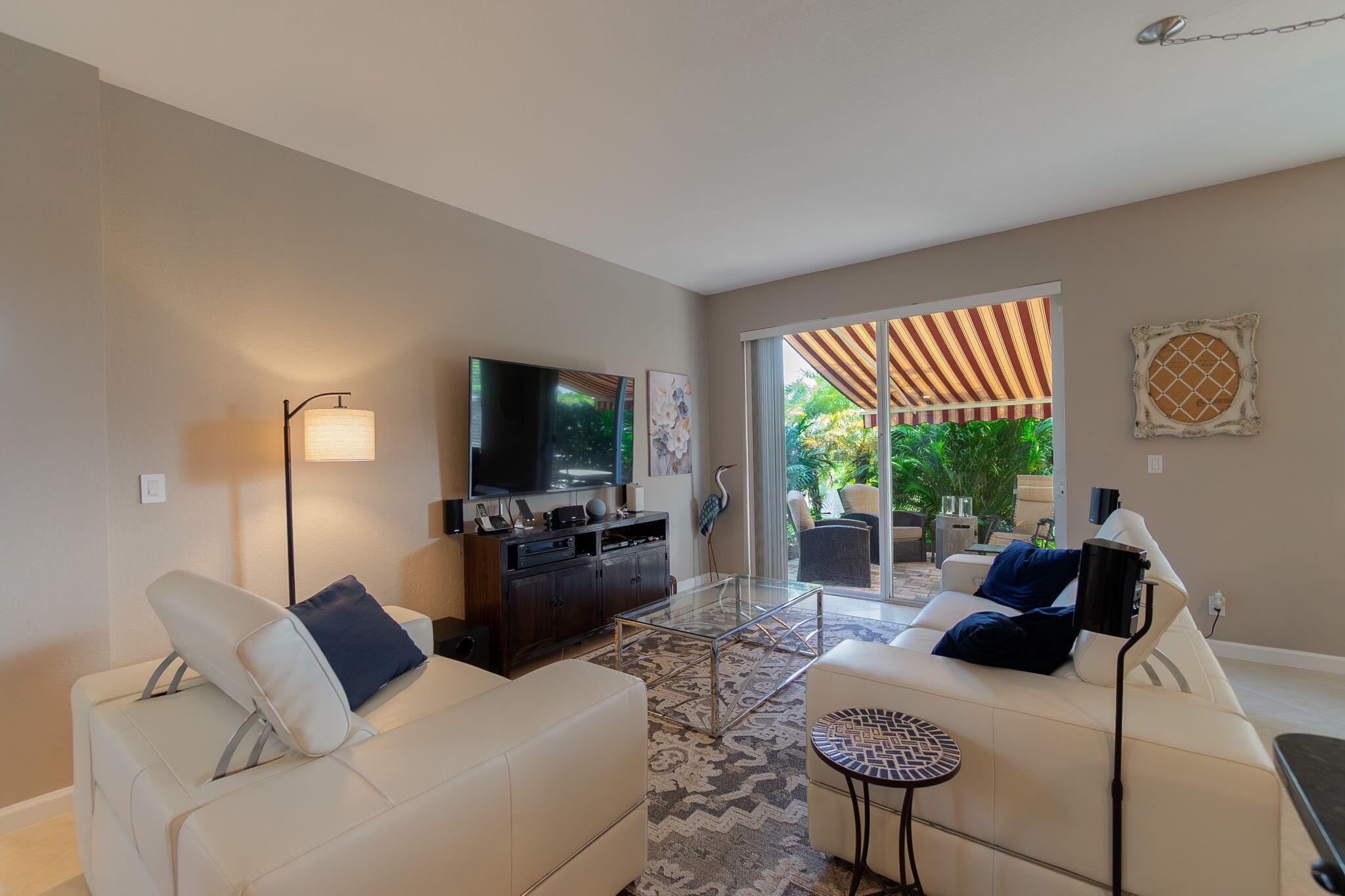 1004 Center Stone Lane Riviera Beach, FL 33404 - Photo 12 of 47 a living room with furniture and a flat screen tv