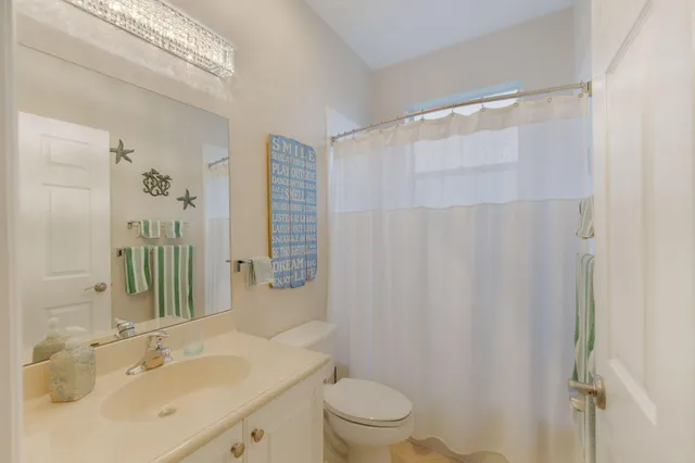 a bed room with a bed and a television