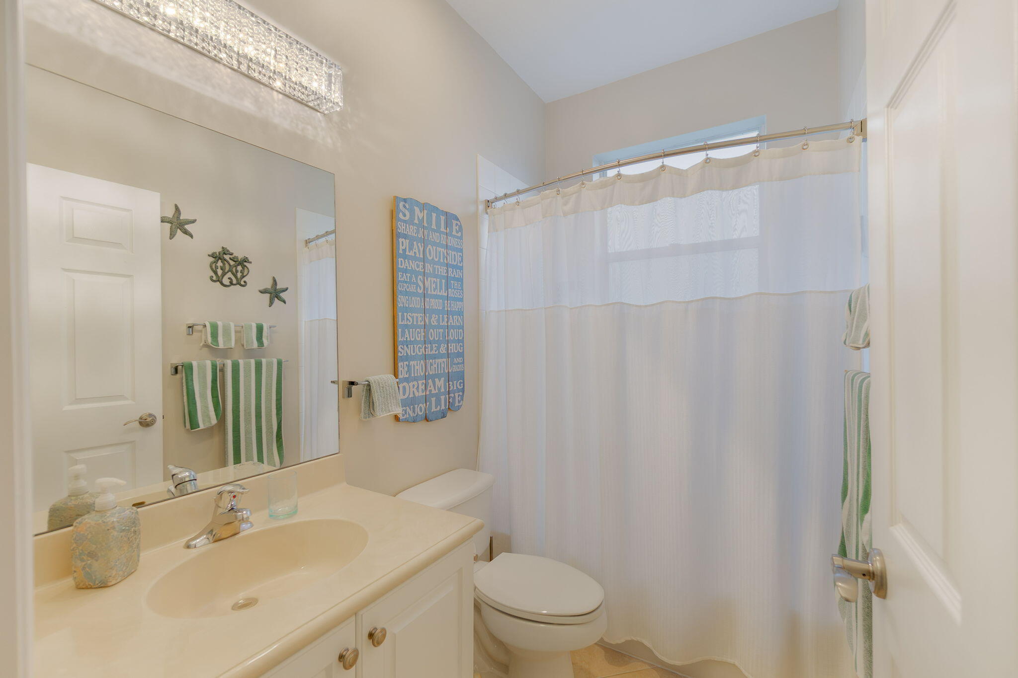 1004 Center Stone Lane Riviera Beach, FL 33404 - Photo 22 of 47 a bathroom with a sink a toilet and shower