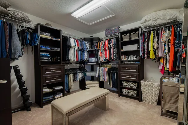 a large bathroom with a sink mirror and a shower