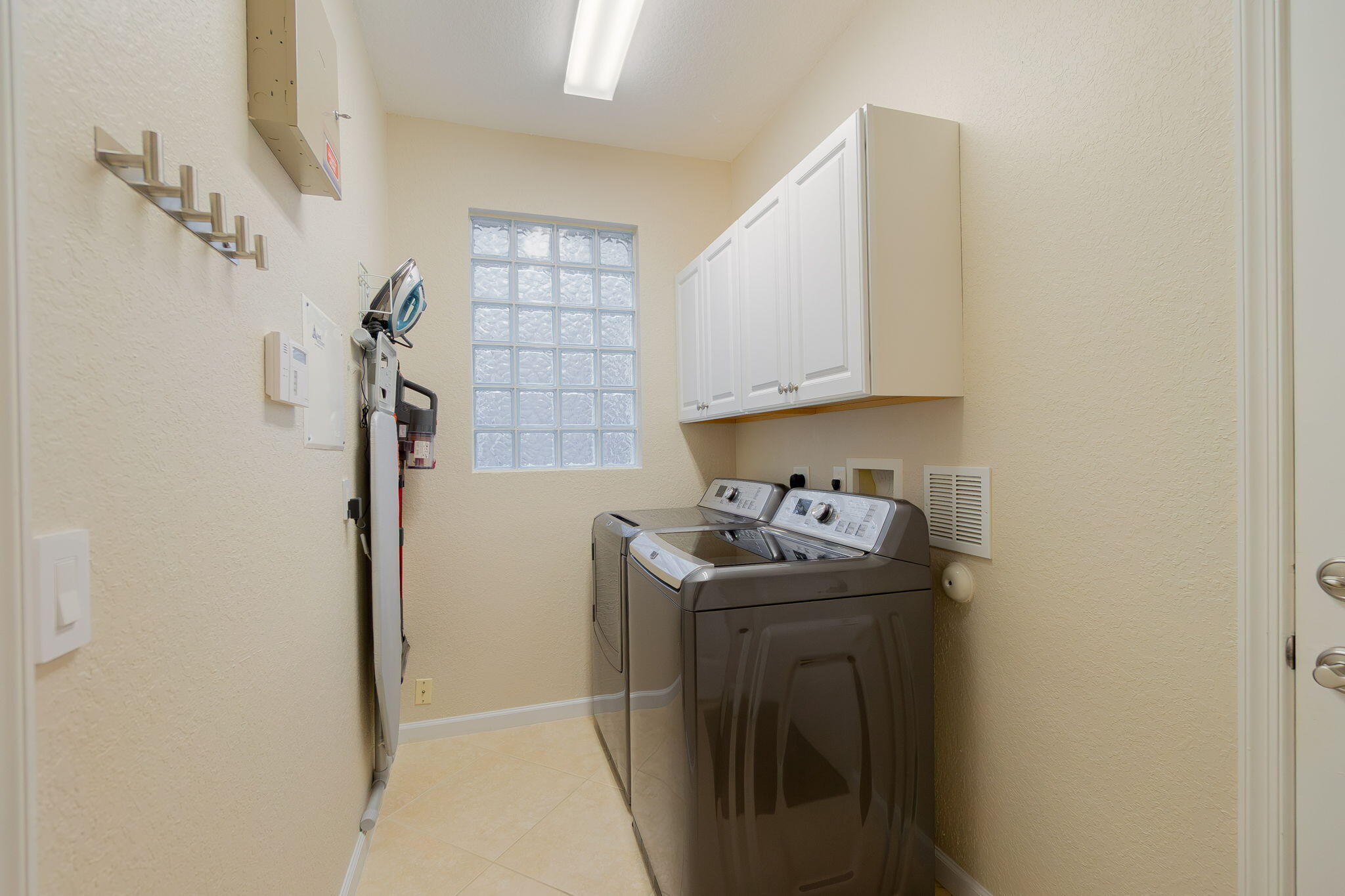 1004 Center Stone Lane Riviera Beach, FL 33404 - Photo 33 of 47 a room with storage and utility