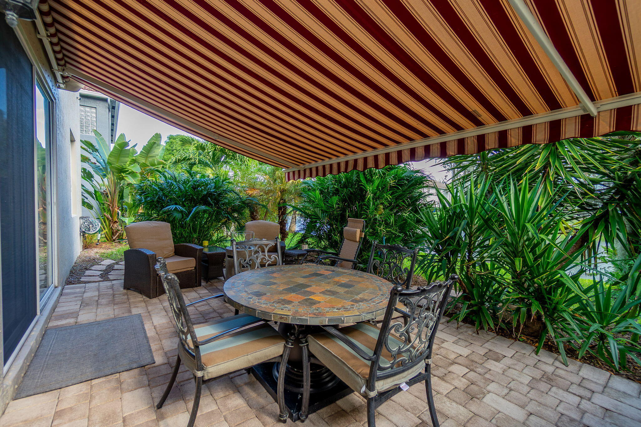 1004 Center Stone Lane Riviera Beach, FL 33404 - Photo 36 of 47 a backyard view with a seating space