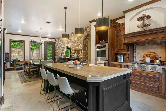a dining table with chairs and window