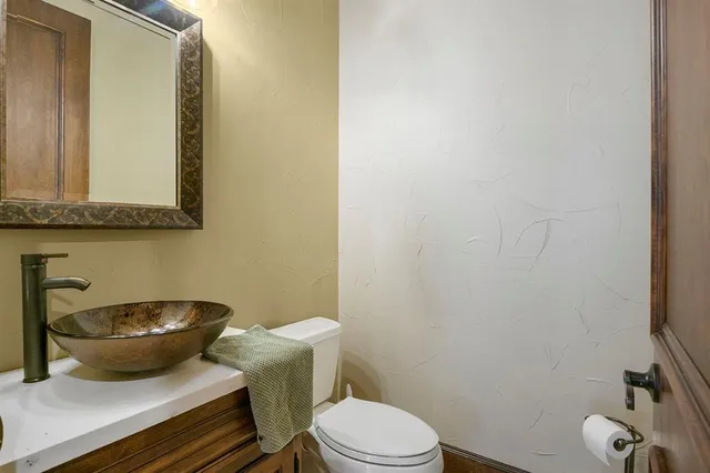 a bathroom with a toilet and a sink