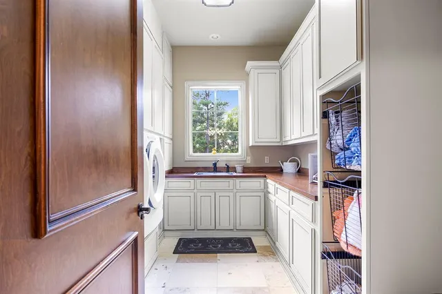 a kitchen with a sink stove and refrigerator