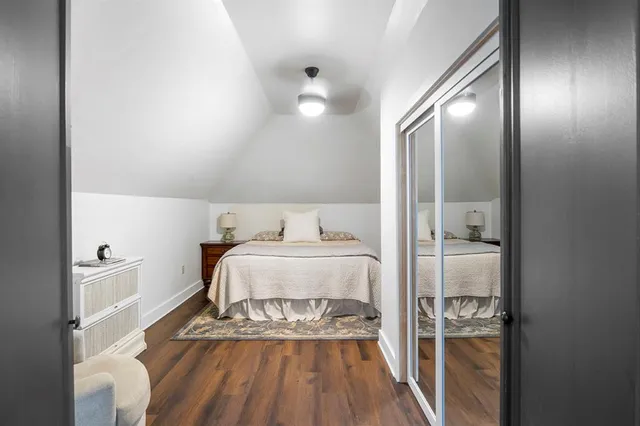 a bedroom with a bed and glass door