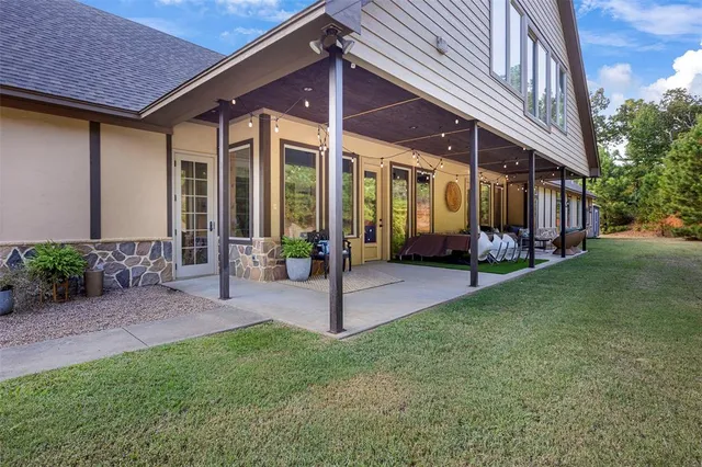 a view of a house with a yard porch and patio