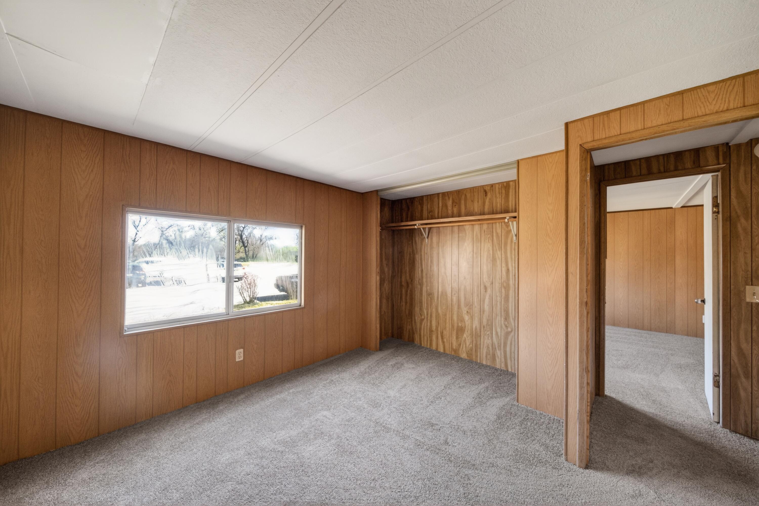 21133 Ronald Street Anderson, CA 96007 - Photo 19 of 26 an empty room with windows & cabinet