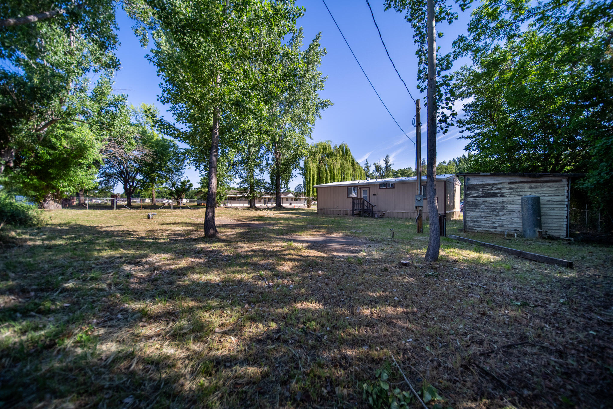 21133 Ronald Street Anderson, CA 96007 - Photo 25 of 26 a view of a tree in the middle of a yard