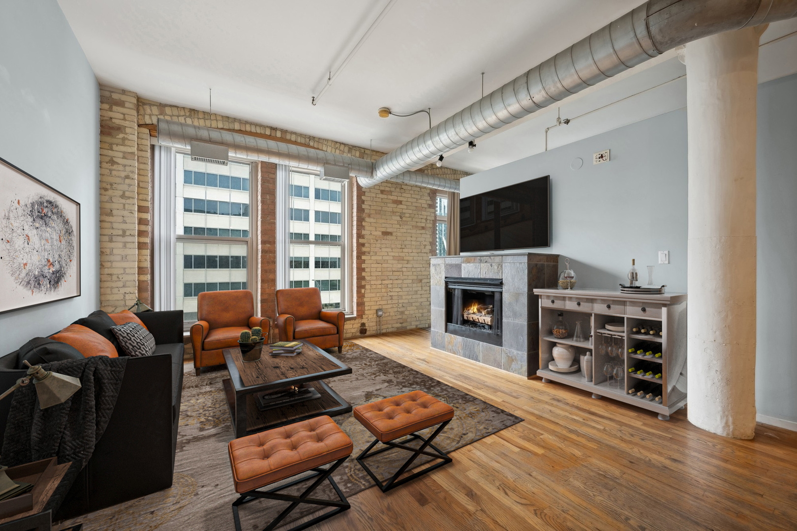 420 South Clinton Street, Unit 317A Chicago, IL 60607 - Photo 2 of 17 a living room with furniture fireplace and flat screen tv
