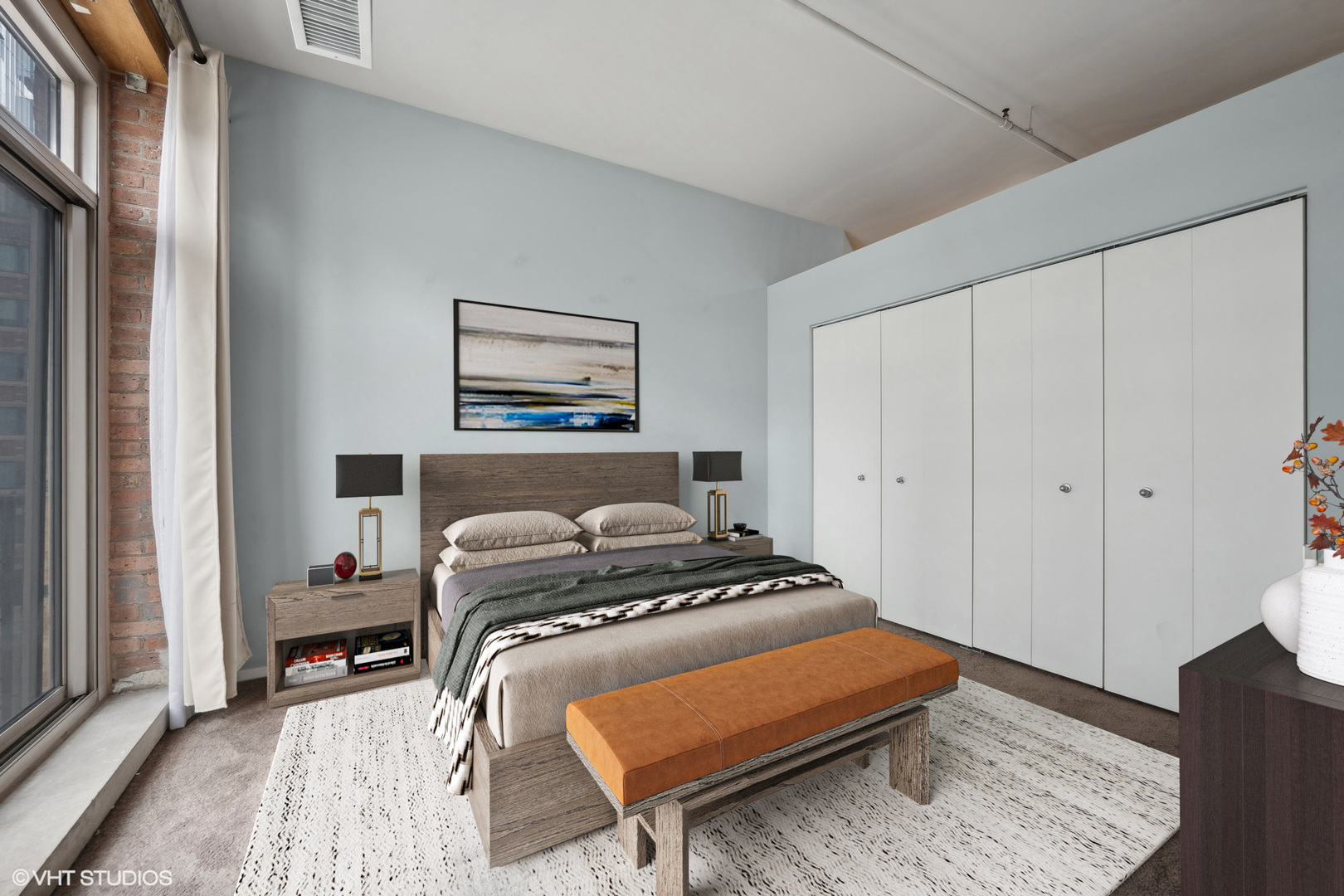 420 South Clinton Street, Unit 317A Chicago, IL 60607 - Photo 5 of 17 a bedroom with a bed and a lamp with wooden floor