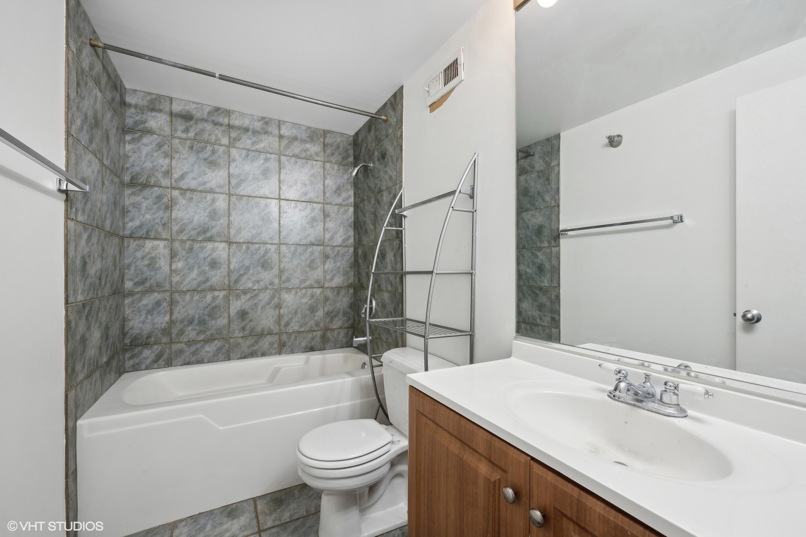 420 South Clinton Street, Unit 317A Chicago, IL 60607 - Photo 8 of 17 a bathroom with a sink toilet and shower